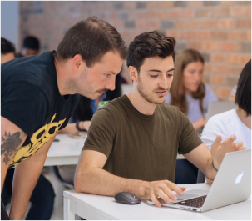  Instructor helping student in classroom