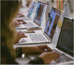  three students in front of white wall